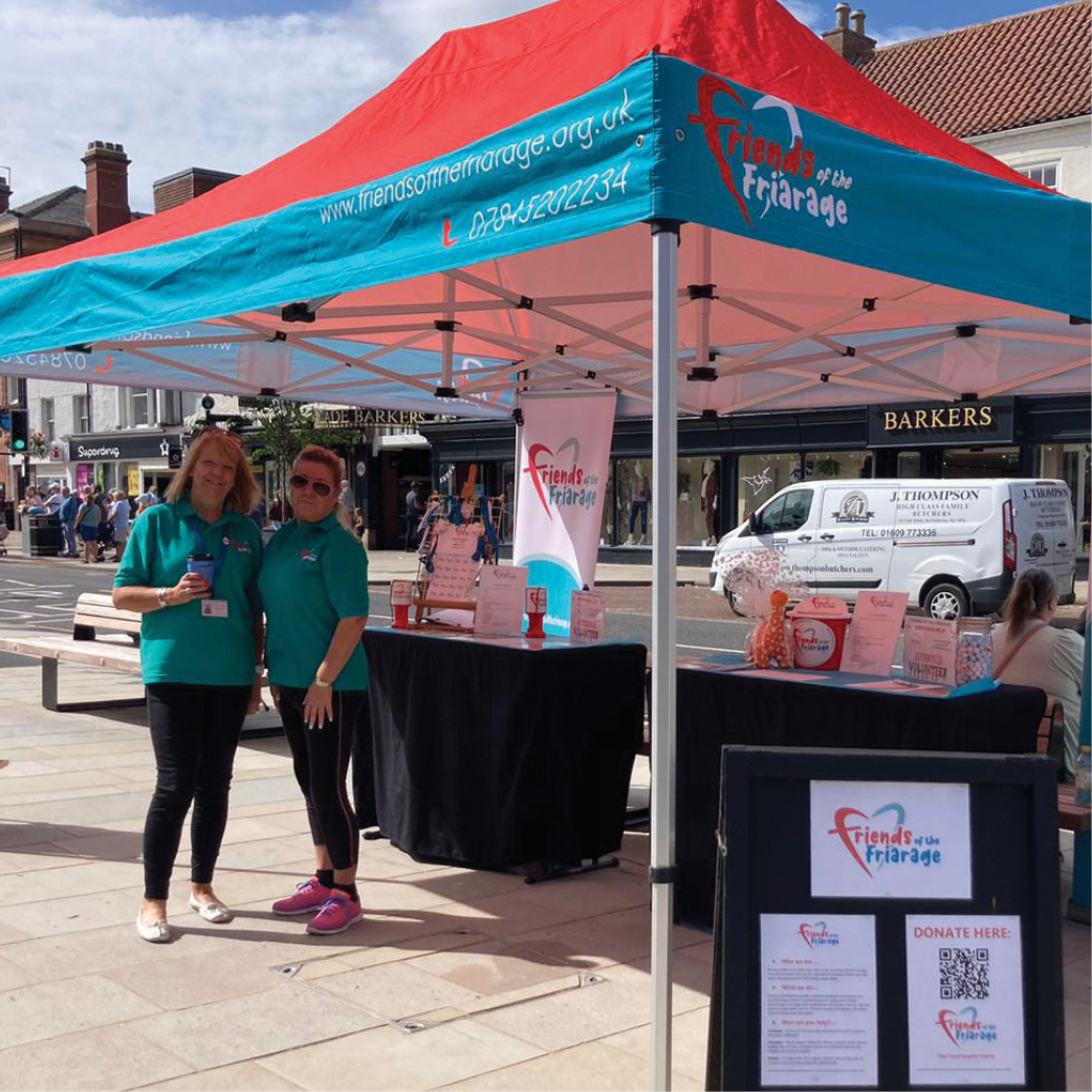Volunteers at our event stand